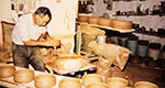 Simos, the father of Giannis Apostolidis, making cooking utensils